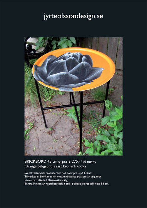 Brickbord 45 cm ø orange bakgrund svart kronärtskocka